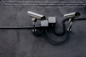 What distinguishes a surveillance camera from a security camera