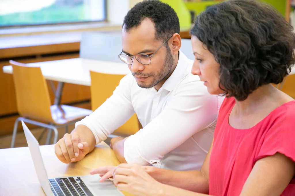 Parents engagement doing work on laptop for school management software